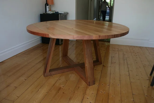 Round timber dining table deals